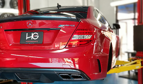 Red Mercedez car rearview at HG Performance receiving services