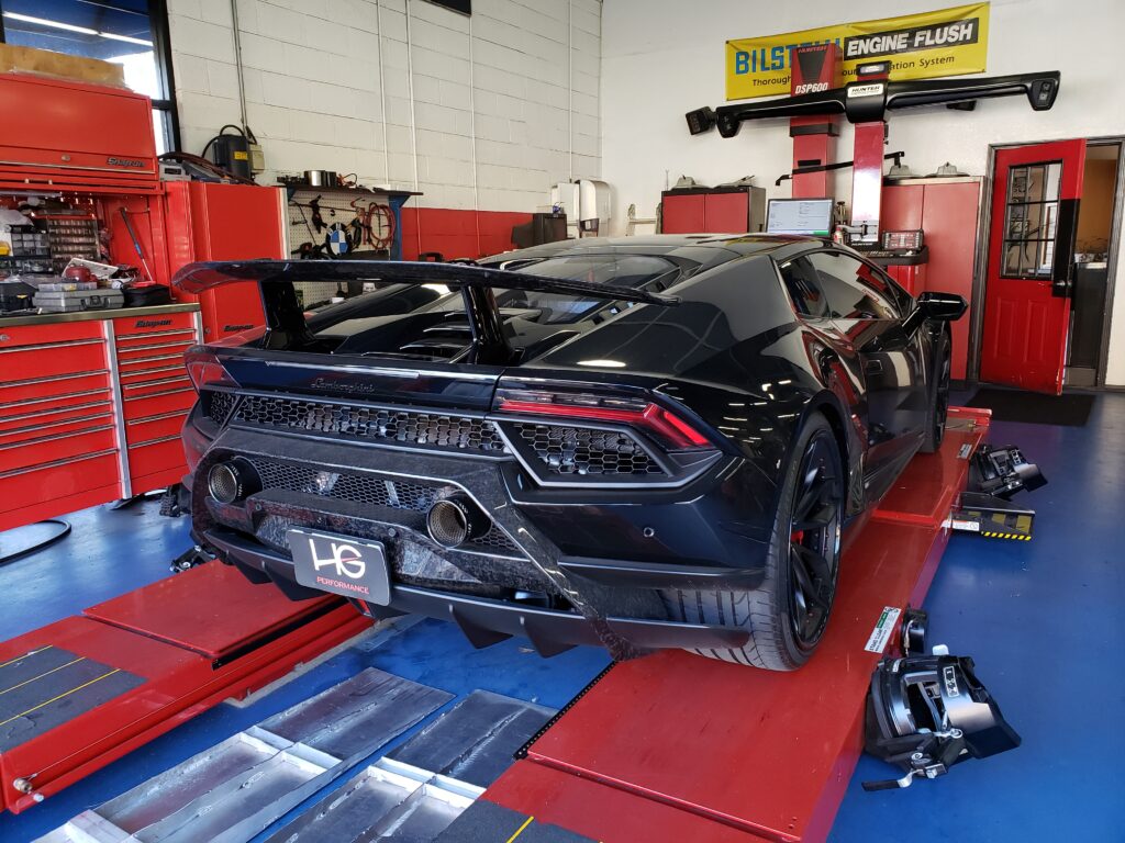 Hunter HawkEye laser alignment machine in use for advanced alignment on an exotic car