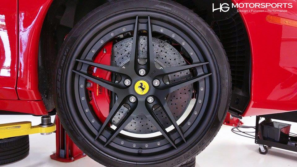 Modified Ferrari 458 Spider showcasing lowered suspension and custom wheels